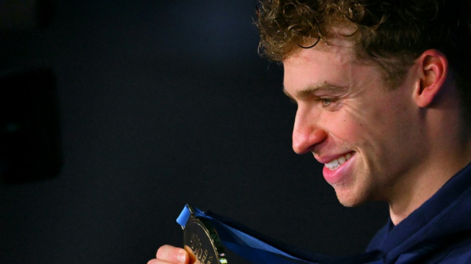 Magic Marchand adds gold to world record as McIntosh wins again