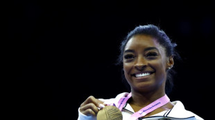 Biles dazzles with beam and floor golds to reach 23 world titles