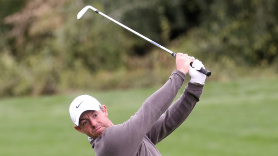 Bland shares Dubai lead as McIlroy heads for driving range