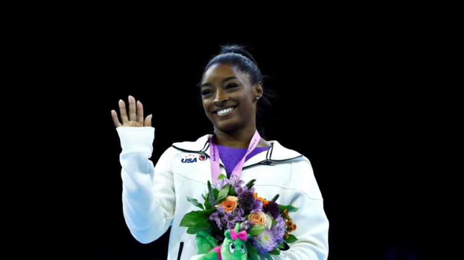 Biles wins beam and floor golds to reach 23 world titles