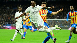 Madrid beat Valencia but Benzema off injured