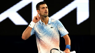 Djokovic defies controversy to surge into Australian Open final