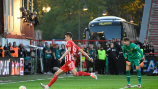 Union stun Dortmund and stay top after Kobel error
