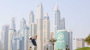 McIlroy comes through 'battle' to edge bitter rival Reed in Dubai