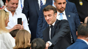 Lager-than-life president: Macron downs a beer to cheers, and criticism