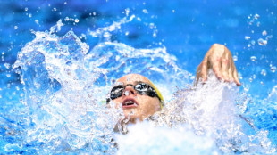 Australia's McKeown shatters 100m backstroke world record 