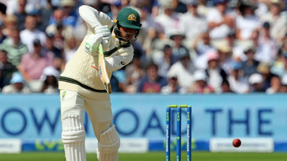 Australia's Khawaja holds firm as Ashes opener heads towards climax