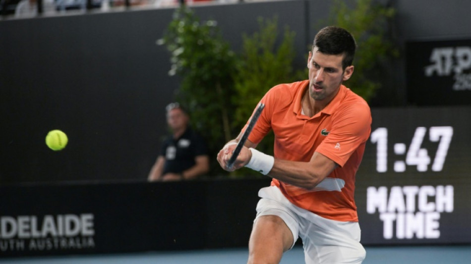 Djokovic survives marathon before winning Adelaide title