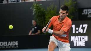 Djokovic survives marathon before winning Adelaide title