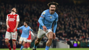Slick Man City sink Arsenal to seize top spot in title race