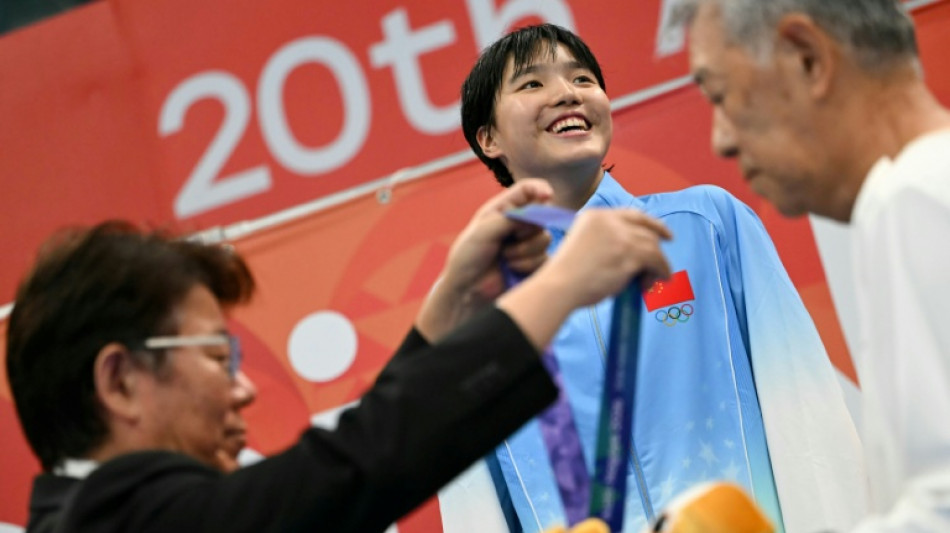 China's Yu, 13, wins third Asian Games gold but has 'some regrets'