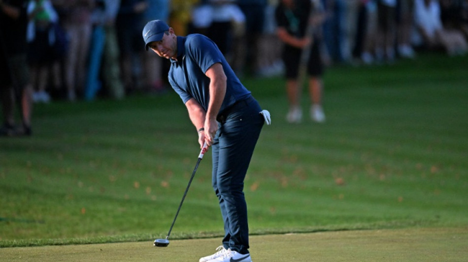 McIlroy's closing birdie keeps Wentworth cut bid alive amid fan clashes