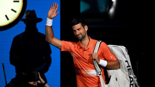 Djokovic 'a bit emotional' after warm return to Australian Open