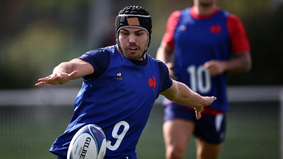 France's Dupont trains with headguard before World Cup quarter-final