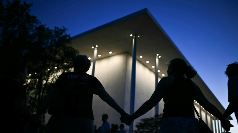 Protesters form human chain at Kennedy Center after Trump threat