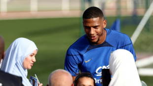 French footballer asked to explain laugh during minute's silence