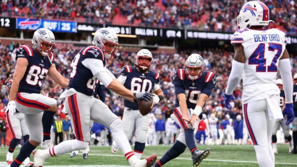 Jones sparks Patriots in Bills NFL upset, Ravens thrash Lions 